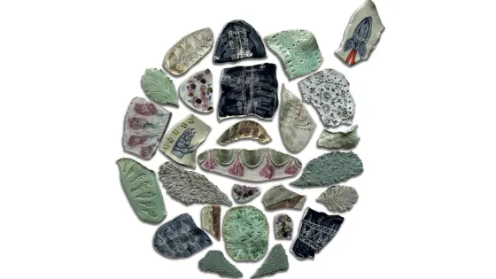 An assortment of ceramic pieces in various shapes, colors, and patterns, arranged on a white background.