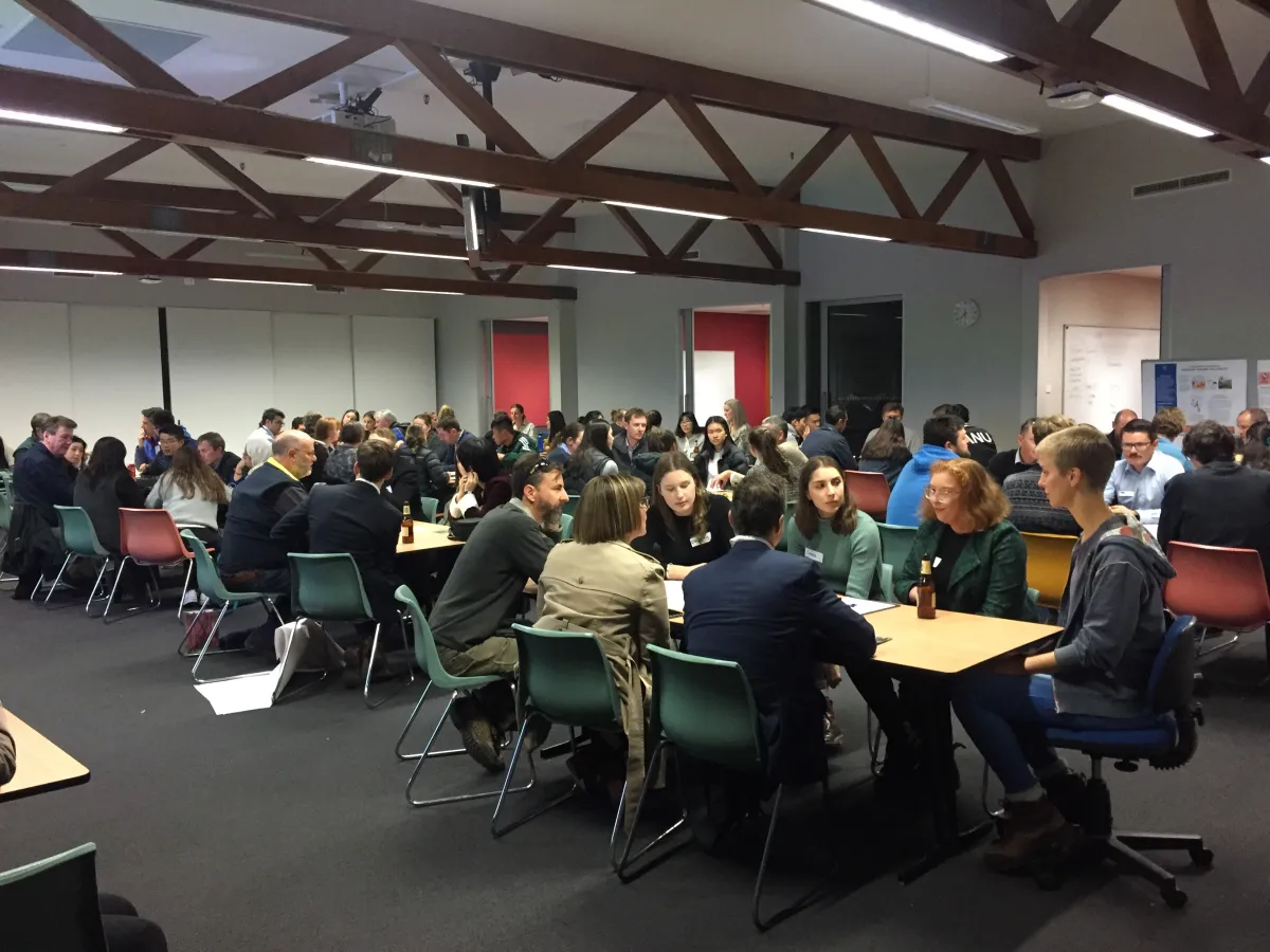 Students in a classroom discus the forestry industry during the 'World Cafe' session.