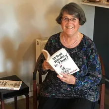 Libby Robin holding her book.