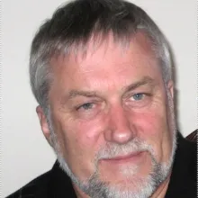 Ian Noble looks at camera