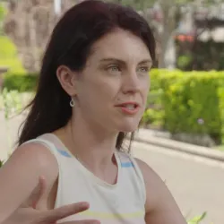 Sarah explaining her research to someone off camera.