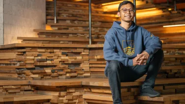 A man sitting on wooden steps