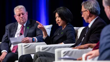 Professor Xuemei Bai on stage with Al Gore
