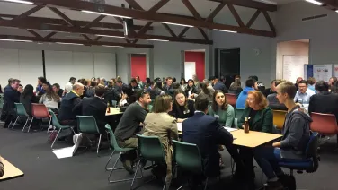 Students in a classroom discus the forestry industry during the 'World Cafe' session.