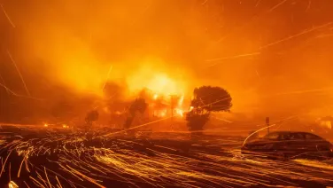 Fire in LA with sparks in the foreground.